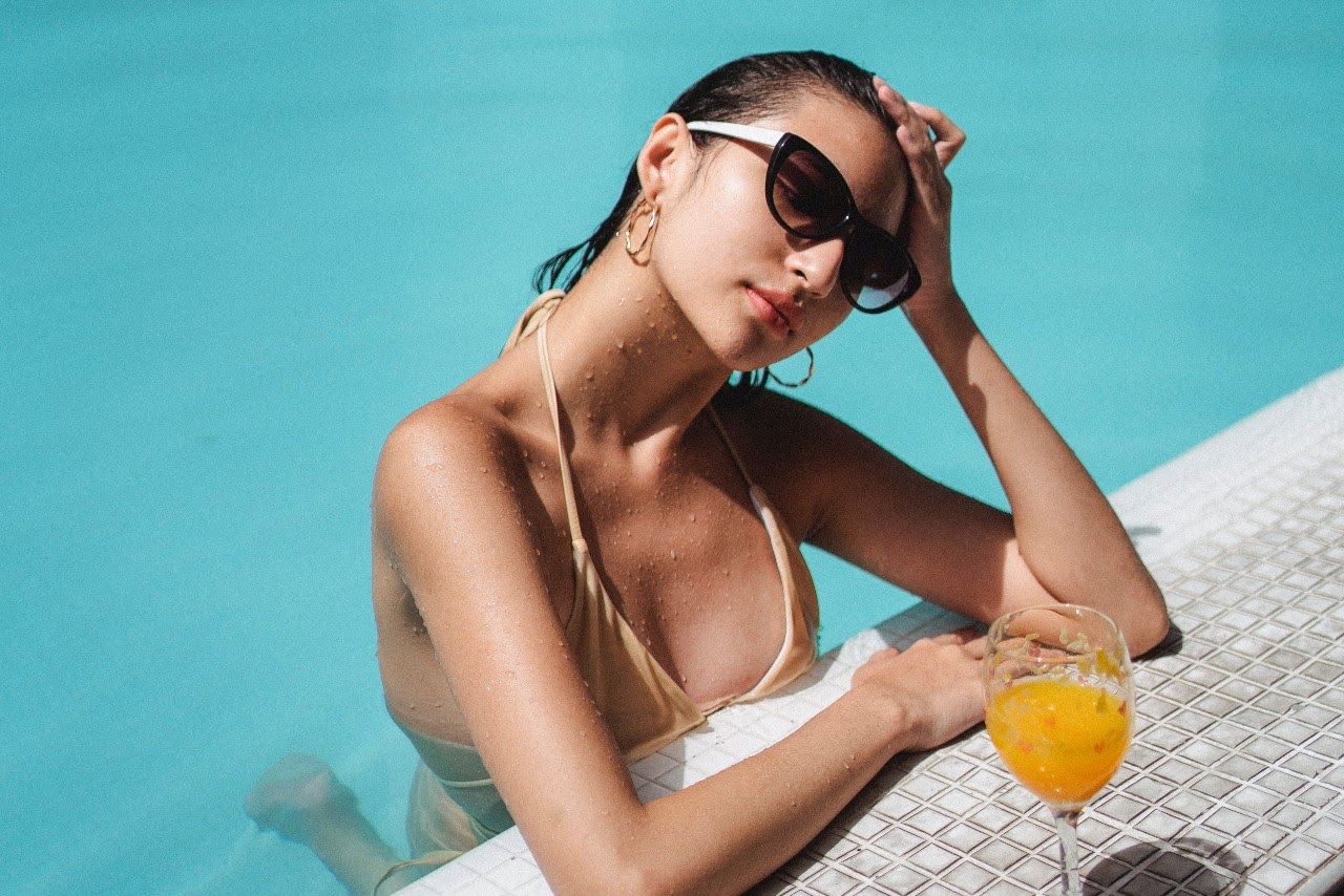 woman sitting pool side