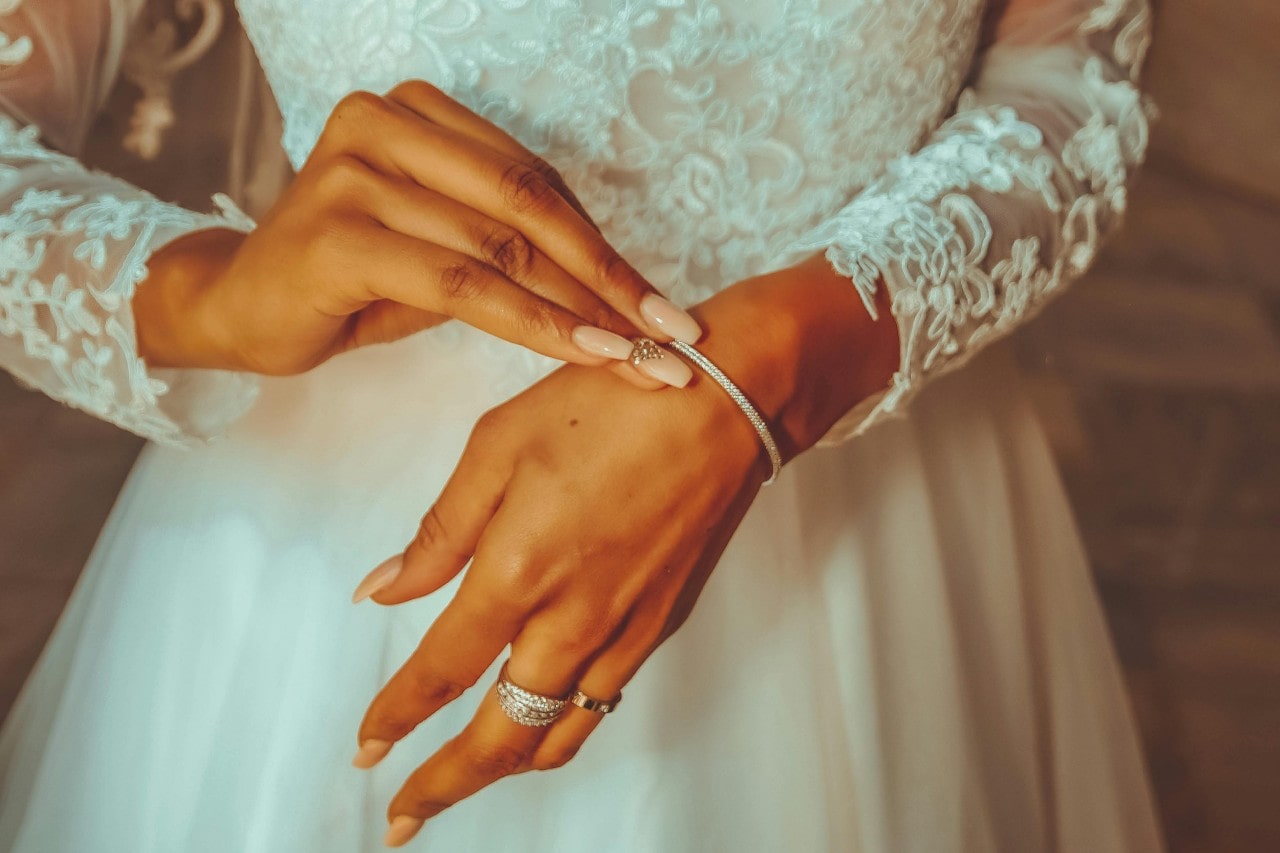 A bride adjusting her diamond bracelet